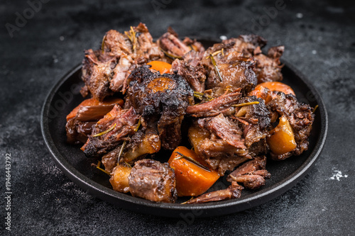 Obraz na plátně Homemade beef and lamb oxtail ragout in skillet, gelatin rich slow cooked meat w