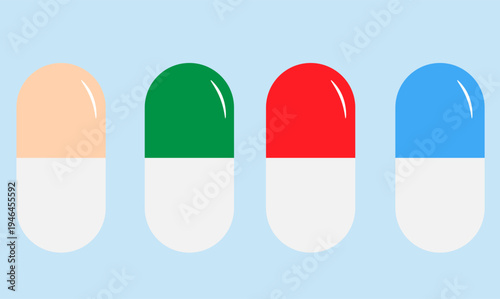 four colored capsules of medicine on a blue background,