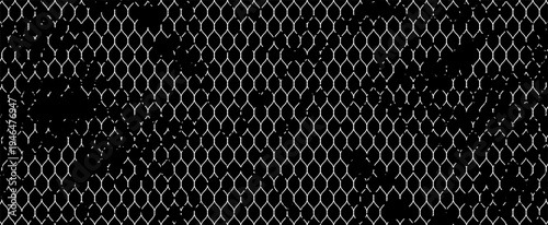 Abstract black and white grunge background featuring a distressed chain link fence pattern with rough textures, creating an urban industrial style design.