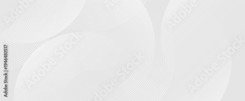 Elegant abstract geometric background with glowing white circular lines and smooth gray gradient, perfect for technology concepts, website banners, presentations, and creative templates.