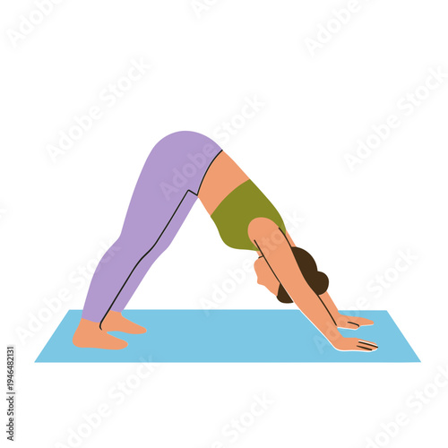 Woman performs downward facing dog yoga pose on mat indoors