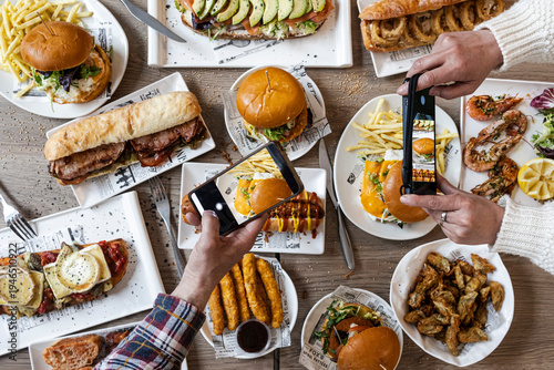 People taking flat lay food photos with smartphone