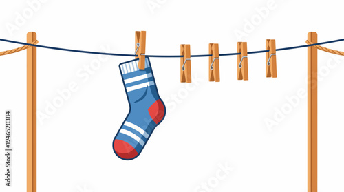 A blue sock with red and white details hangs on a clothesline outdoors.