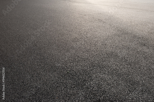 Wallpaper Mural High angle view of gray asphalt road surface texture with sunlight reflection Torontodigital.ca