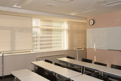 Wallpaper Mural Interior of an empty modern classroom with whiteboards, desks, and morning sunlight Torontodigital.ca