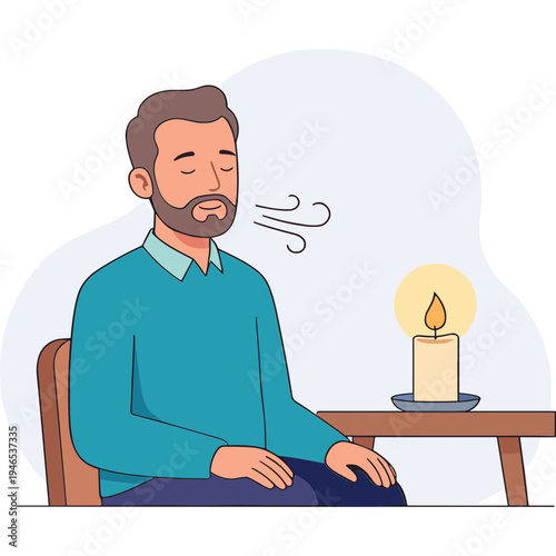 Man meditates peacefully while sitting next to a lit candle on a table indoors.