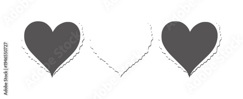 Two dark grey hearts with torn paper edges white