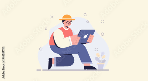 A person in a hat and glasses kneels with a tablet