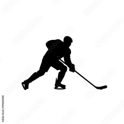 A hockey player in a black uniform is skating on the ice with a hockey stick.