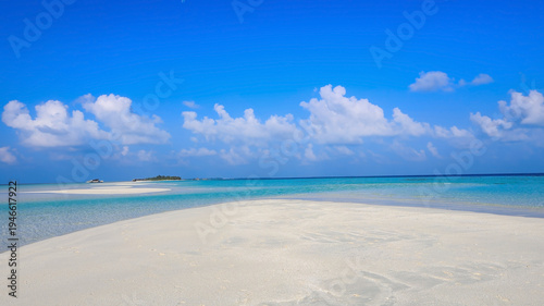 Tableau sur toile Summer lagoon Ripples in the sand at low tide on a beach with sandbar and blue s