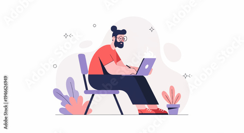 A person with glasses, beard, and bun hairstyle works on a laptop