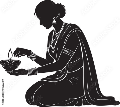 Elegant silhouette of a woman in traditional Indian attire, kneeling and lighting a sacred oil lamp for a spiritual cultural celebration