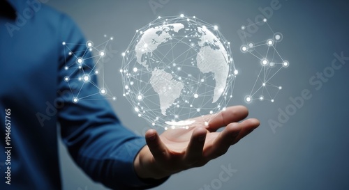 Man's hand holding glowing digital globe representing global network and connectivity