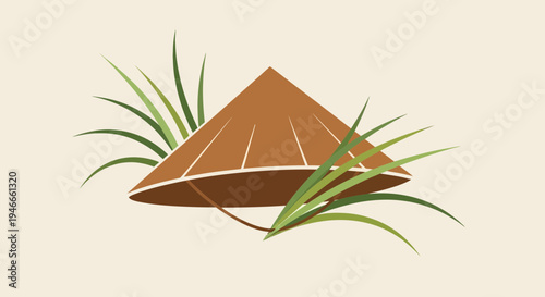 Asian conical hat (nón lá) nestled in green grass, traditional culture symbol