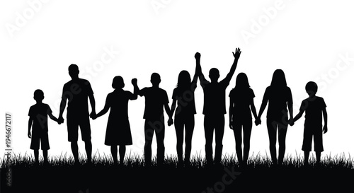 Silhouette of diverse group of people standing together in unity and friendship outdoors