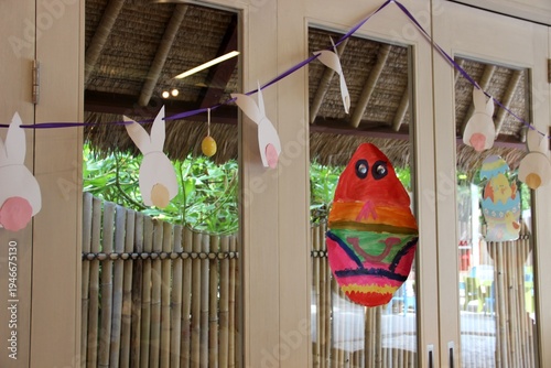 Easter child decorations home made attached to the window in the school.