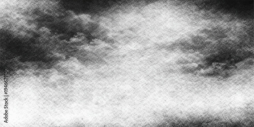 Abstract grunge black and white background with a dark textured cloudscape featuring mist and smoke for a dramatic storm design