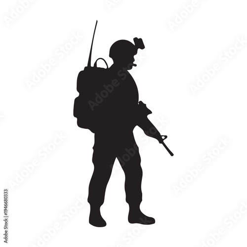 Silhouette of a fully equipped military soldier standing ready with a large backpack and rifle