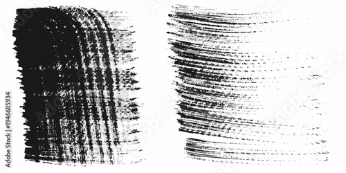 Black mascara brush strokes against a clean white background