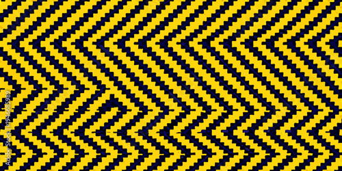 A vibrant geometric pattern featuring repeating yellow and black chevrons