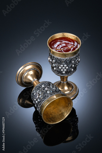 Couple Copper Antique Vintage Brass Shot Glass Gilded on black background. metal Wine Cup goblet with Carving Engraving pattern.