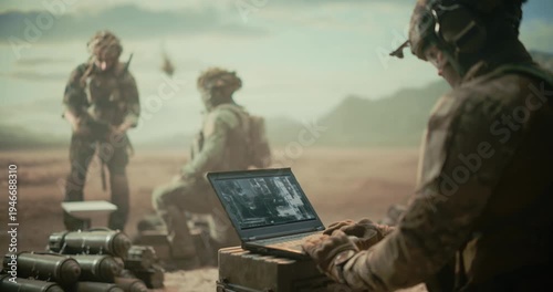 Special Forces Soldiers Run a Desert Surveillance Base, Analyzing ISR Imagery on Laptop, Relaying Reconnaissance Data, Coordinating Target Tracking With Field Team During  War Combat Operation