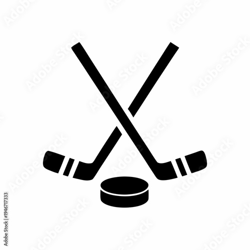 Professional hockey equipment with crossed sticks and puck