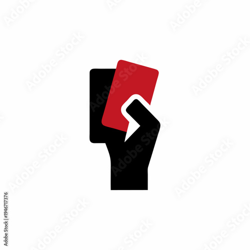 Dramatic hand holding red card in darkness