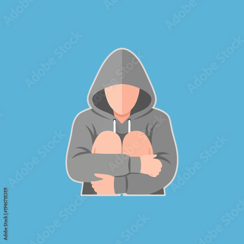 Person with hooded sweatshirt sitting with knees drawn up, head bowed.