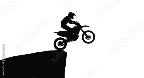 Motocross rider performing a jump against a white background silhouette