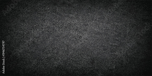 A dark, textured black fabric background featuring a macro textile pattern and a rough, grunge material surface for a grey wallpaper backdrop