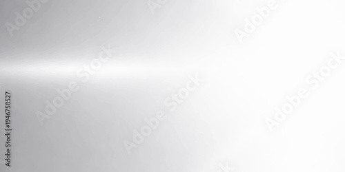 A brushed metal plate features a shiny stainless steel texture with fine gray lines and a light silver pattern across the metallic surface for a modern industrial backdrop