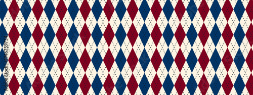 Traditional argyle pattern with blue and red rhombus shapes. Fabric diamond print for sweater, plaid or wrapping paper. Simple geometric background. Father Day wallpaper. Vector illustration.