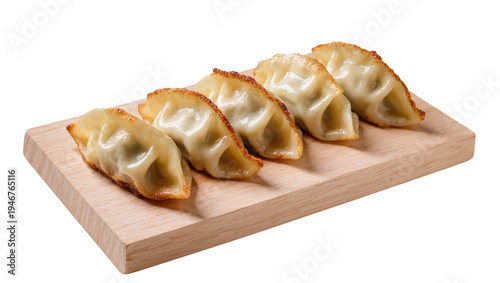 Isolated traditional crispy fried gyoza dumplings on a wooden board, delicious Asian cuisine