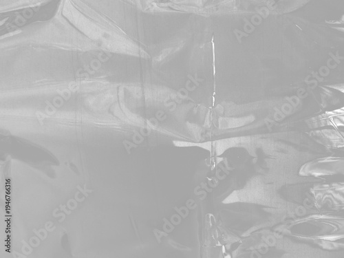 Fotografie plastic wrap film wrinkled texture transparent reflective highlights isolated re