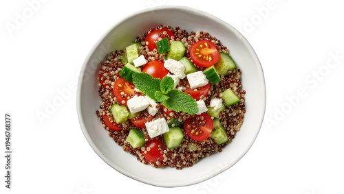 Isolated healthy quinoa salad bowl with fresh tomatoes, cucumber, feta cheese, and mint