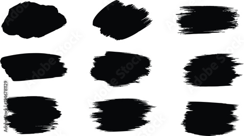 Collection of nine black brush stroke shapes on white background