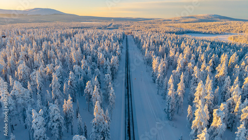 Quiet winter landscape in Akaslompolo, Lapland, Finland showcasing a snowy railway