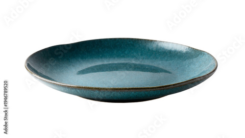 Isolated empty ceramic serving plate in deep teal with a rustic rim for food presentation