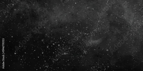 Abstract rain drops on a black window create a starry galaxy effect with dark water droplets mimicking a cold cosmic nebula across a deep blue night sky starfield