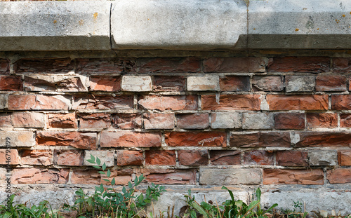 a ruined brick wall, a fragment of an ancient structure