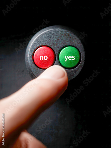Finger pressing a green yes button next to a red no button on a control panel symbolizing choice and decision-making in a close-up view