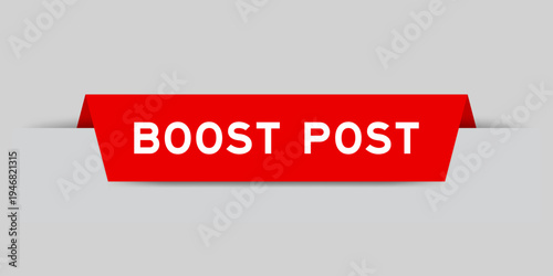Red color inserted label with word boost post on gray background