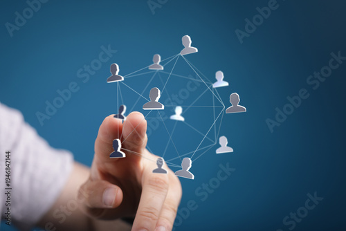 Hand pointing at a network ...
