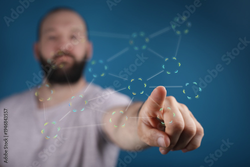 Focused man touching a digi...