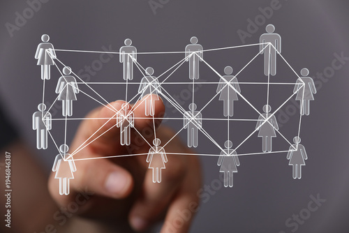 Hand touching a network of ...