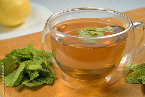 Fotografie Green tea is a natural aromatherapy and wellness drink that helps to relieve stress and hydrate the body