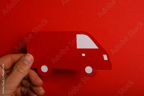 Paper cutout of a red van b...