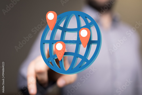 Person pointing at a globe ...