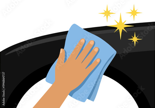 Hand cleaning and polishing a black surface with a microfiber cloth